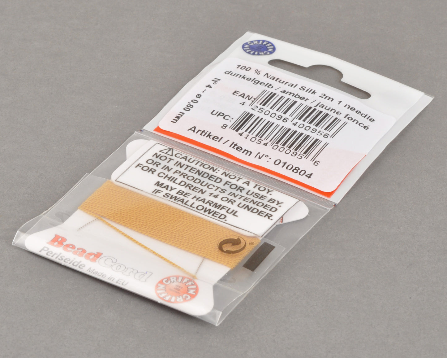 Griffin natural silk bead cord size 4 amber with attached twisted needle 2 meter card