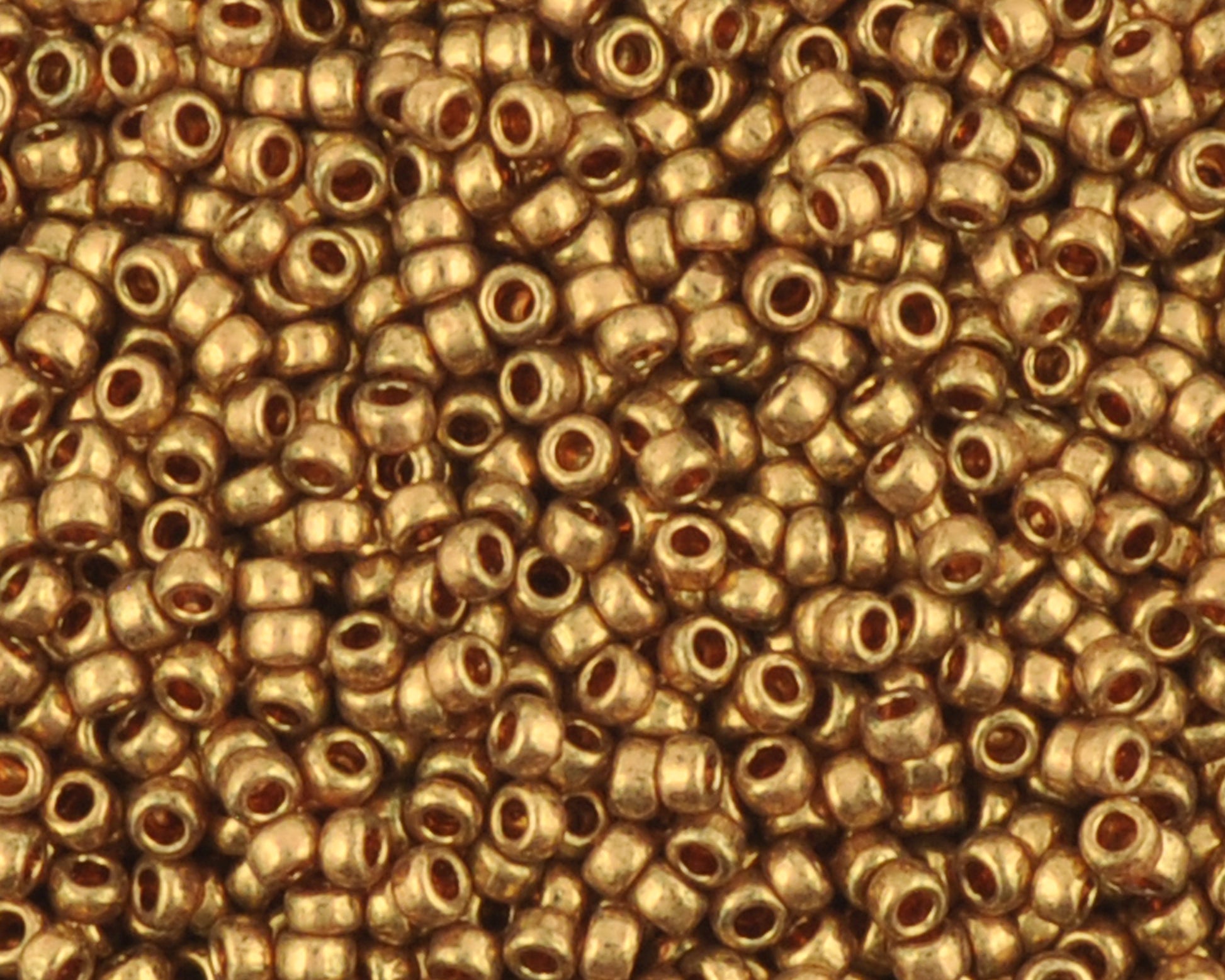 Miyuki 15/0 round seed beads in 457L metallic light bronze, 7 gram tube