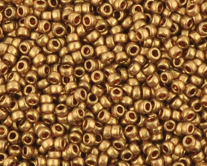 Miyuki 15/0 round seed beads in 457L metallic light bronze, 7 gram tube