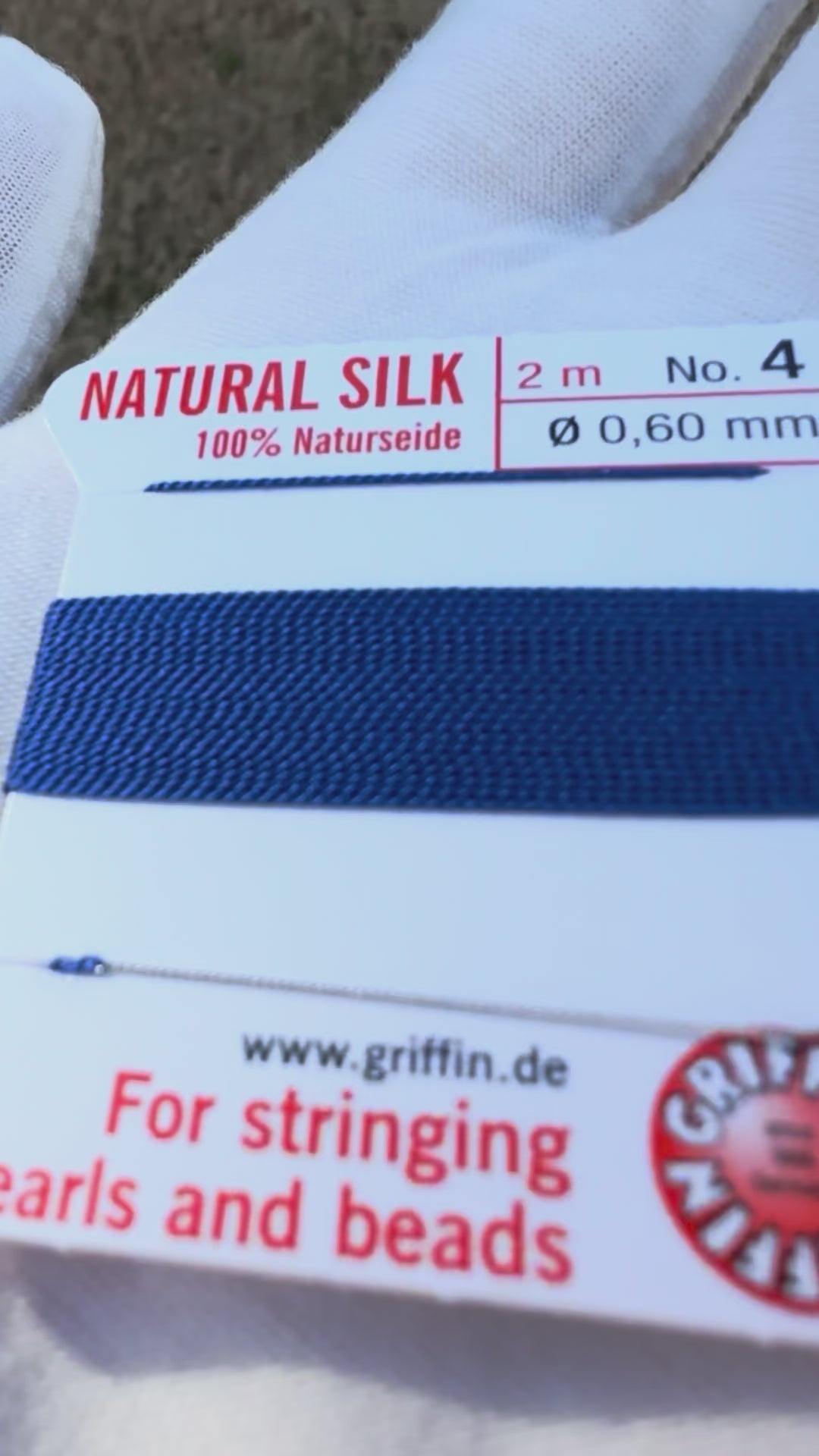 Griffin natural silk bead cord size 4 dark blue with attached twisted needle 2 meter card