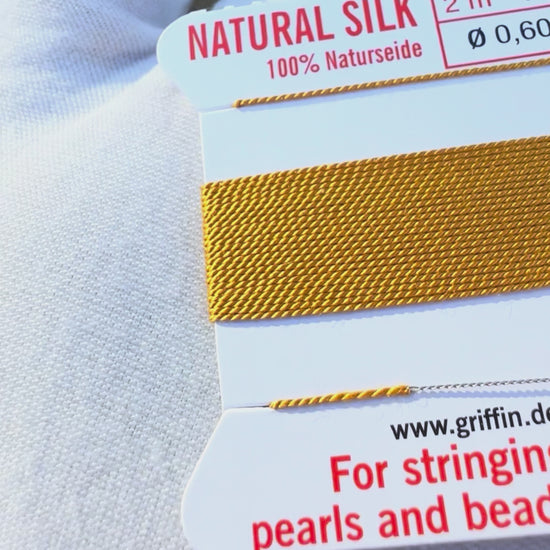 Griffin natural silk bead cord size 4 amber with attached twisted needle 2 meter card